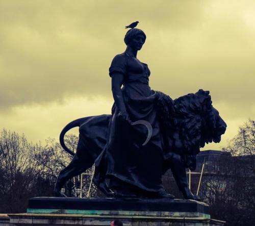 Woman with Lion Statue